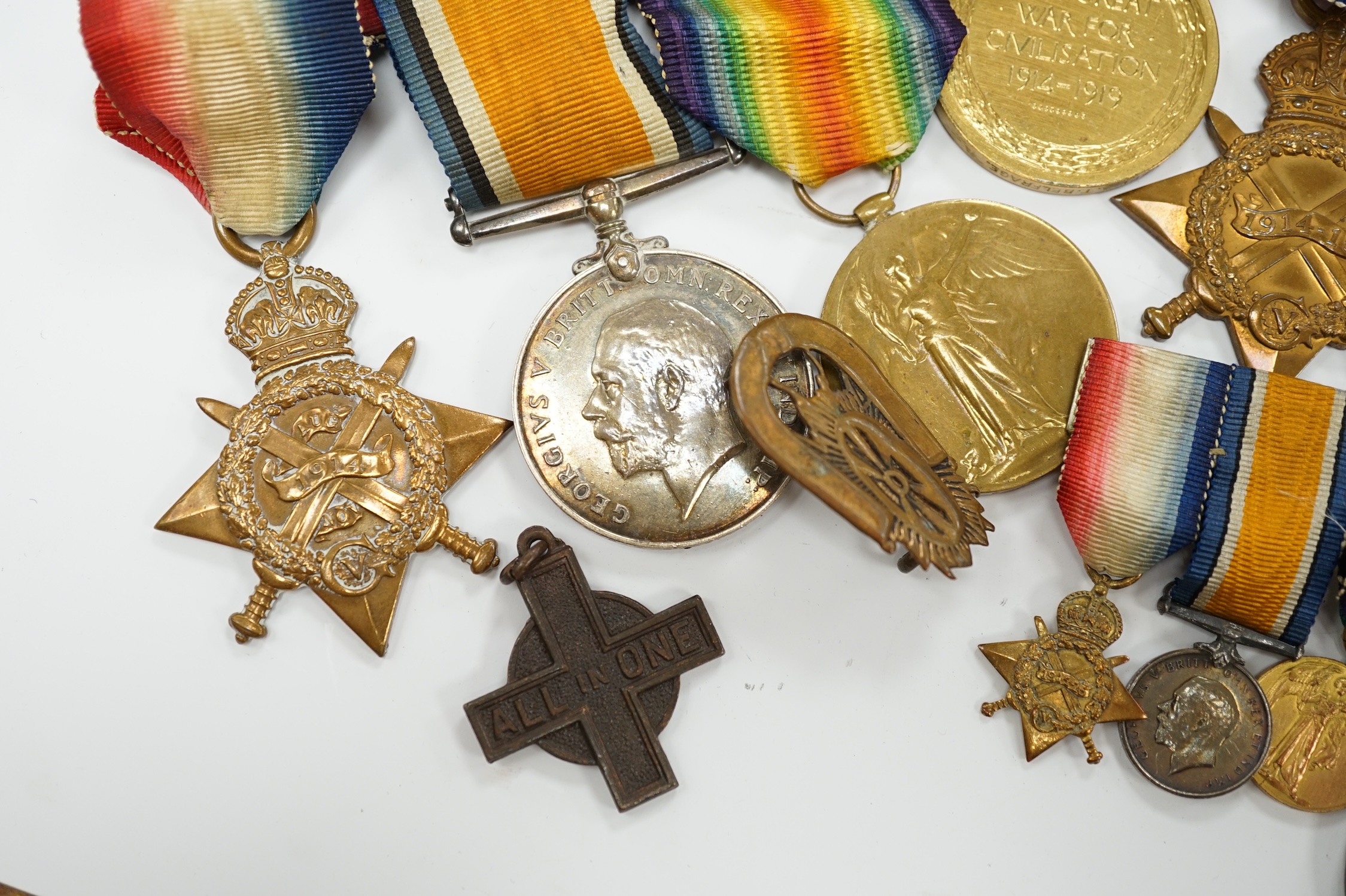 Three First World War medal trios awarded to; Pte. W.C. Belfrage 3rd Canadian MTD Rifles, Cpl. R.W. Wells R.F.A. and Pte. F.G. Walker R.A.M.C. together with two additional British war medals, two miniature metal groups,